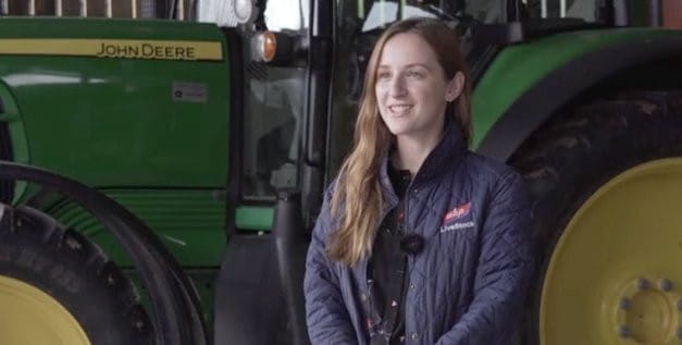 rebekah in front of tractor