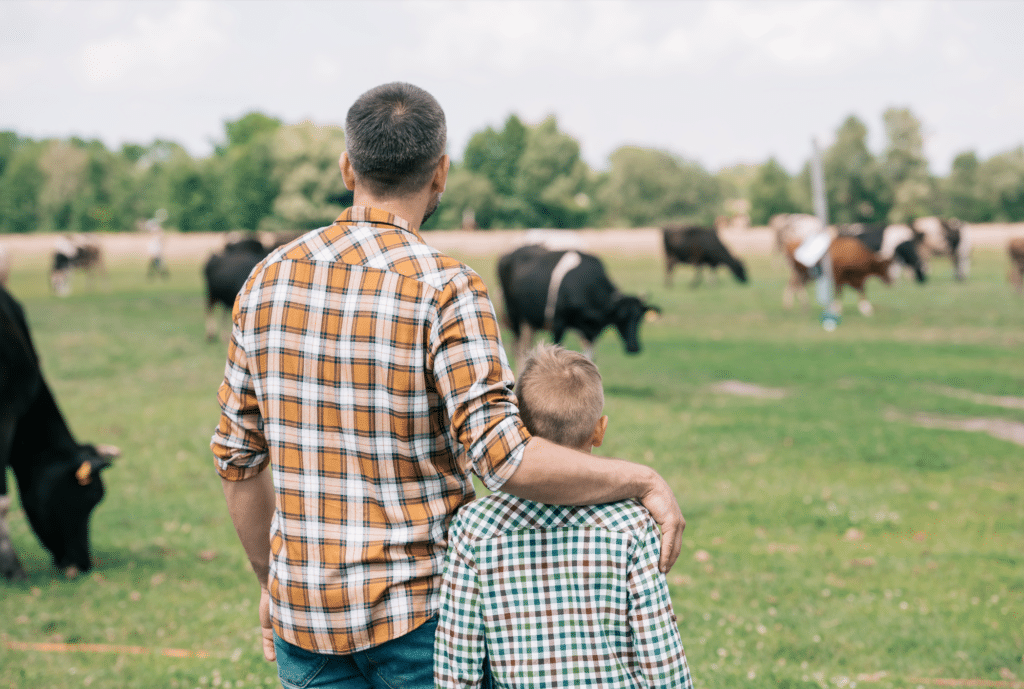 rancher and son in field
