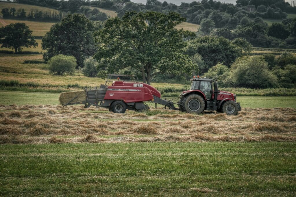 Tractor and baler in field